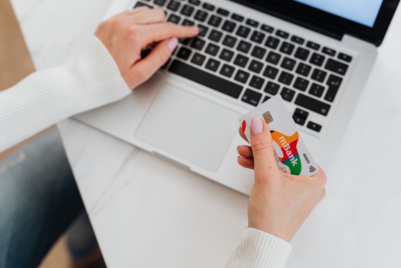 Person managing finances on a laptop