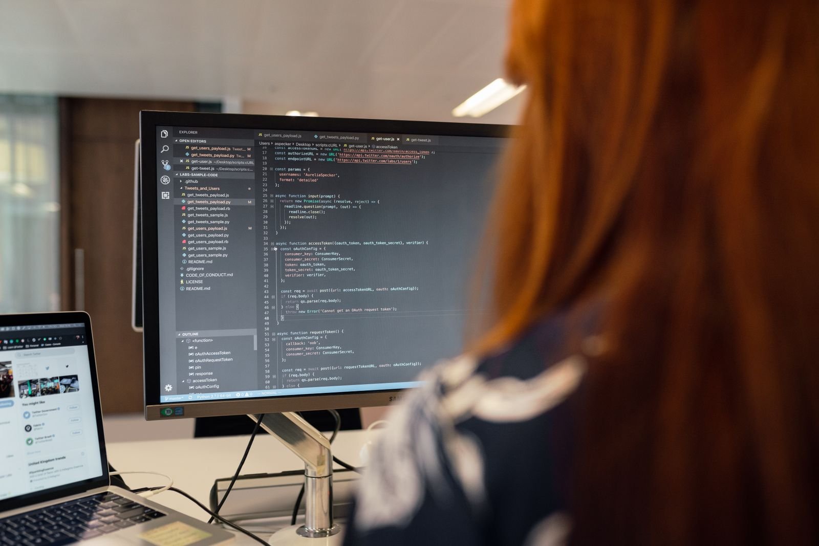 Developer building a SaaS platform on screen